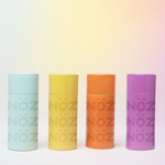 Load image into Gallery viewer, All four varieties of Nöz sunscreen lined up in blue, yellow, orange and purple
